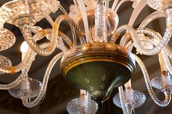 veentian villas in verona, the detail of the decors of a chandelier