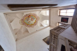 Stairs in the entrance of venetian villa and frescoed ceiling